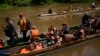 FILE - Migrants heading north arrive via boats to Lajas Blancas, Panama, June 28, 2024, after walking across the Darien Gap from Colombia. 