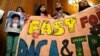 DACA recipients hold up a sign after an event by Democrats calling for congressional Republicans to bring forward immigration legislation on Capitol Hill in Washington, Sept. 6, 2017.