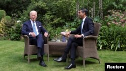 British Prime Minister Rishi Sunak meets with U.S. President Joe Biden at 10 Downing Street in London, July 10, 2023, 