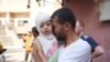 A Palestinian man says goodbye to his sick daughter before she was to leave the Gaza Strip to get treatment abroad through the Kerem Shalom crossing, in Khan Younis, Gaza Strip, June 27, 2024.