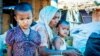 Members of a Rohingya refugee family at a ramshackle shanty colony in the north Indian state of Haryana. (Zafor Alom/VOA)