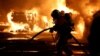 Crews extinguish vehicle fires during clashes between protesters and police, after the death of a 17-year-old teenager killed by a French police officer during a traffic stop, in Nanterre, France, June 28, 2023.