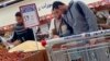Egyptians buy groceries at a supermarket in Cairo, Feb. 26, 2023. 