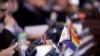 FILE - A flag supporting LGBTQ+ rights decorates a desk at the Statehouse in Topeka, Kansas, March 28, 2023. The U.S. Supreme Court agreed to weigh in on gender-affirming care.