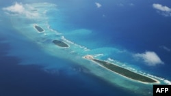 FILE - An aerial view of Qilianyu islands in the Paracel chain, which China considers part of Hainan province, on Aug. 10, 2018.
