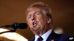 FILE - Republican former President Donald Trump speaks at a primary election night party, Jan. 23, 2024, in Nashua, NH. 