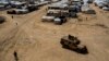 Iraq repatriates nearly 700 more citizens linked to Islamic State group from Syrian camp