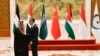 FILE - China's Foreign Minister Wang Yi shakes hands with Saudi Arabia's Foreign Minister Prince Faisal bin Farhan Al-Saud at a meeting of foreign ministers from Arab and Muslim-majority nations at the Diaoyutai State Guest House in Beijing, Nov. 20, 2023. 