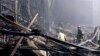In this photo released by Russian Emergency Ministry Press Service on March 23, 2024, firefighters work in the burned concert hall after an attack on the building of the Crocus City Hall in Moscow, Russia. (Russian Emergency Ministry Press Service via AP)