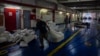 Workers prepare a ship of the Freedom Flotilla Coalition at Tuzla seaport in Istanbul, Turkey, April 19, 2024. A three-ship flotilla trying to reach Gaza with humanitarian aid from Turkey was prevented from sailing by Guinea-Bissau authorities, said flotilla organizers.