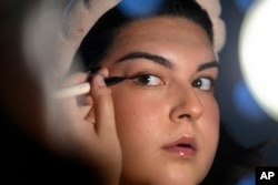 Daniella Lopez White, of Hawaii, May 14, 2024, at her apartment in Boston. López White, who graduated from Emerson College in Boston this month and is on a tight budget, said TikTok influencers have helped her with tips on how to find affordable clothes.