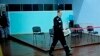 Russian opposition leader Alexei Navalny is seen on a TV screen as he appears in a video link provided by the Russian Federal Penitentiary Service during a hearing in Melekhovo, Russia, on Aug. 4, 2023.