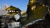 A photograph shows a hole in a roof of a multistore building damaged as a result of falling debris after a massive drone attack overnight in Kyiv on May 20, 2023.