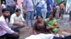 Women mourn next to the body of a relative outside the Sikandrarao hospital in Hathras, Uttar Pradesh state, India, July 2, 2024. At least 60 people are dead and scores are injured after a stampede Tuesday at a religious gathering in Hathras district.