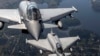 FILE - Italian Air Force Eurofighter Typhoon military fighter jets fly in Lithuanian airspace, Sept.12, 2023. German Chancellor Olaf Scholz said Saturday that a project to possibly supply Turkey with Eurofighter jets is in the early stages. 