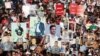 People and families of the victims of Aug. 4, 2020, Beirut port blast carry their pictures during a march as Lebanon marks the three-year anniversary of the explosion in Beirut, Lebanon, Aug. 4, 2023. To date, no one has been held to account for the explosion.
