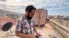 Sami Albah, shown on Sept. 17, 2023, lost his sister, her husband and parents-in-law, and their four children in the flood, in Derna, Libya.