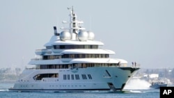 FILE - The superyacht Amadea sails into the San Diego Bay on June 27, 2022. The $325 million superyacht was seized by the United States from a sanctioned Russian oligarch. 