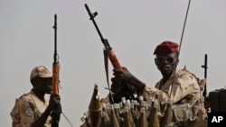 FILE - Sudanese soldiers from the Rapid Support Forces secure the area in the East Nile province, Sudan, June 22, 2019.