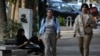 FILE - Iranian women walk in Tehran, Iran, neither wearing a hijab, on Aug. 5, 2023. Iran's parliament has passed legislation that imposes severe penalties for hijab violations. The law is to take effect Dec. 13, 2024.