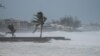 Waves batter a pier as Hurricane Beryl passes through Hastings, Barbados, July 1, 2024. Beryl later made landfall in Grenada.