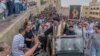 Coptic Bishop Uannas, the head of the Virgin Mary Monastery, blesses believers during a ceremonial procession to the cave church.