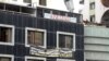 FILE - The sign of Turkey’s first Kurdish-language media outlet, Can Radio and TV, is seen in the heavily damaged Galleria Apartment Complex in Diyarbakir. (Photo: Mahmut Bozarslan/Diyarbakir)
