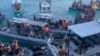 This screengrab taken from a handout video filmed on June 17, 2024 shows Chinese coast guard personnel (L,R) aboard their inflatable boats blocking Philippine navy boats (C) during a confrontation at the Second Thomas Shoal in the South China Sea.