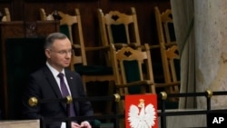 FILE - Poland's President Andrzej Duda attends the first session of the lower house, or Sejm, of the newly-elected parliament in Warsaw, Poland, Nov. 13, 2023.