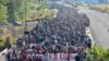 FILE - Migrants depart from Tapachula, Mexico, Dec. 24, 2023.