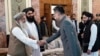 FILE - China's ambassador to Afghanistan, Zhao Sheng, greets Prime Minister Mohammad Hasan Akhund at the Presidential Palace in Kabul, Sept. 13, 2023. China recently accepted the credentials of the Taliban ambassador to Beijing. (Taliban handout via AP)