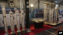 FILE - Iran's domestically built centrifuges are displayed at an exhibition of the country's nuclear achievements, in Tehran, Iran, Feb. 8, 2023.