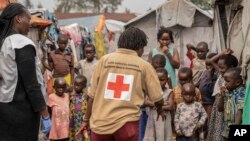 Red Cross officials create awareness of mpox in the Don Bosco refugee camp in Goma, Democratic Republic of the Congo, Aug. 22, 2023.
