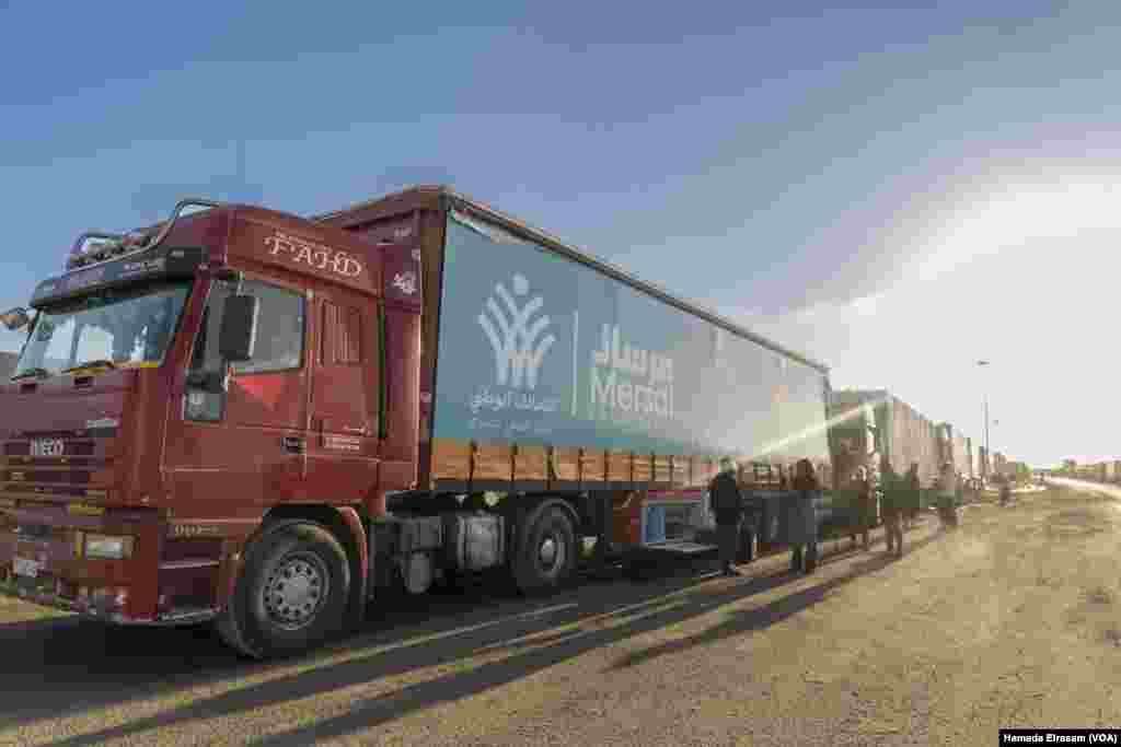 Aid trucks wait at the Rafah border crossing, Egypt, the only operational route into Gaza. The lifeline was effectively cut after Hamas’ October attack, leaving over two million people with limited water, food, fuel, and medical supplies.