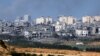 Hancurnya bangunan di Jalur Gaza terlihat dari perbatasan Israel dengan Jalur Gaza, di Israel selatan, 15 Oktober 2023. (Foto: REUTERS/Amir Cohen)