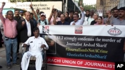 Journalists hold a demonstration to condemn the killing of senior Pakistani journalist Arshad Sharif by Kenyan police, in Karachi, Pakistan, Oct. 24, 2022.