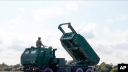 A High-Mobility Artillery Rocket System (HIMARS ) in operation during military exercises at Spilve Airport in Riga, Latvia, Sept. 26, 2022. 