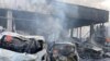 Destroyed vehicles are seen at the site of a Russian military strike in Vinnytsia, Ukraine July 14, 2022. (Press service of the State Emergency Service of Ukraine/Handout via Reuters) 