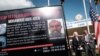 A poster displays the $10 million reward offered by the U.S. for information on terror suspect Mohamoud Abdi Aden of the 2019 Dusit D2 hotel complex attack in Nairobi, at the DCI headquarters in Nairobi, Jan. 12, 2023. 