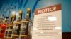 FILE - A sign in the vodka area of a Pennsylvania Fine Wine and Good Spirits store reflects the state's decision to withdraw Russian-made products for sale, in Harmony, Pa., Feb. 28, 2022.