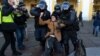Police officers detain a man during a protest against Russian military action in Ukraine, in central St. Petersburg, Russia, March 13, 2022.