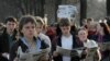 FILE - Belarusian opposition supporters read the opposition newspaper Nasha Niva in public during a flash mob gathering in central Minsk, April 28, 2006. The news outlet's operations and staff fled Belarus after its disputed 2020 election and continue to publish digitally. 