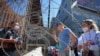 An U.S. Customs and Border Protection agent listens to Russians seeking for a humanitarian visa at the San Ysidro Port of Entry of the US-Mexico border in Tijuana, Mexico, March 15, 2022. 