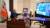 Russian President Vladimir Putin chairs a Security Council meeting via videoconference at the Novo-Ogaryovo residence outside Moscow, Russia, Thursday, March 3, 2022. (Sputnik via AP)