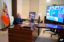 Ruski predsednik predsedava Savetom za bezbednost putem video linka ( Foto: Sputnik via AP)