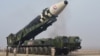 Rudal balistik antarbenua (ICBM) "Hwasong-17" pada kendaraan peluncurannya dalam foto tak bertanggal yang dirilis 25 Maret 2022 oleh Kantor Berita Pusat Korea (KCNA) Korea Utara. (KCNA via REUTERS)