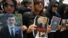 FILE - Relatives and friends of Kurdish journalist and student Sardasht Osman, who was kidnapped and killed last week, protest in front of the Kurdish parliament in the northern Iraqi city of Irbil, May 10, 2010, to demand an investigation into his assassination.