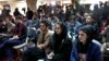FILE - Afghan journalists attend a press conference of a former President Hamid Karzai in Kabul, Afghanistan, Feb. 13, 2022.