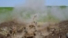Ukrainian troops use U.S.-supplied M777 howitzer artillery in this photo tweeted by the Ukrainian defense ministry on May 13, 2022. 