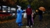 China Eases Some Quarantine for Travelers Even as Cases Rise 
